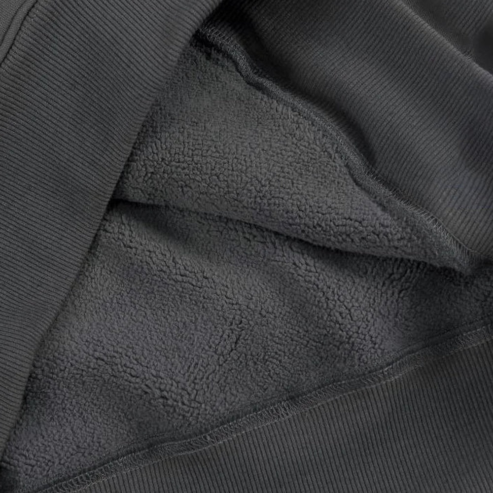 Men's heavyweight cotton hoodie in dark grey, close-up of the soft brushed inside