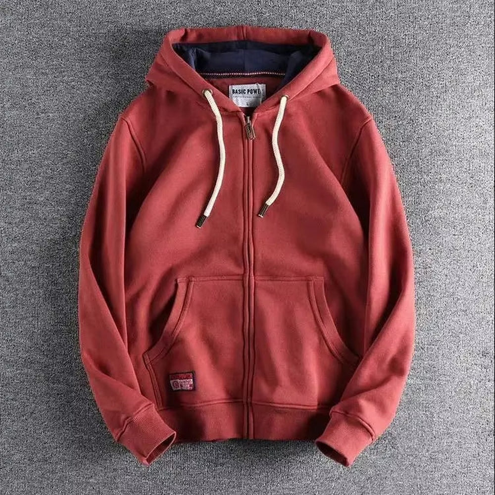 Brick red zip-up hoodie with a navy-lined hood and kangaroo pocket, laid flat | Chaps London