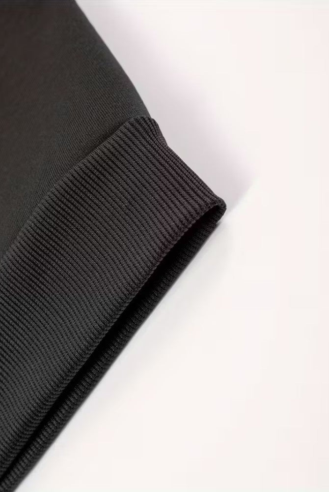 Men's soft-lined winter hoodie in black, close-up of the ribbed cuff