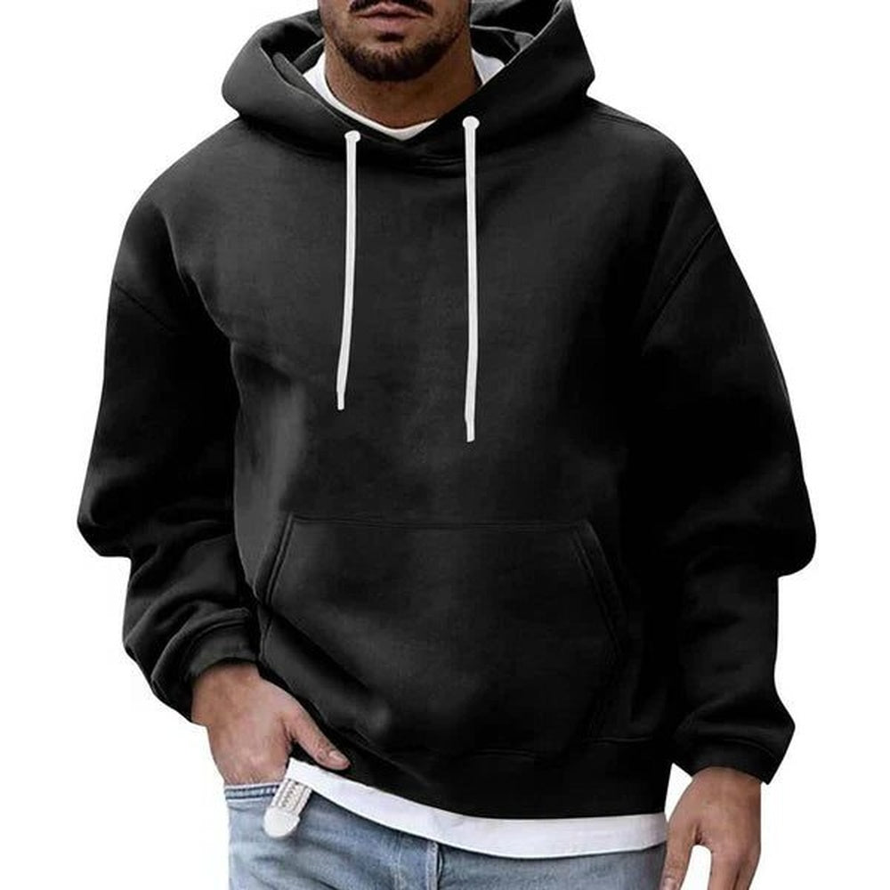 Men's oversized hoodie in black, worn, front view