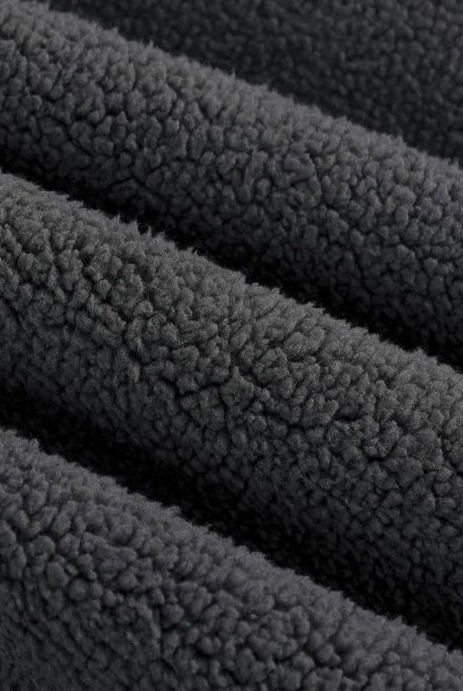 Men's heavyweight cotton hoodie in black, close-up of the brushed inside texture