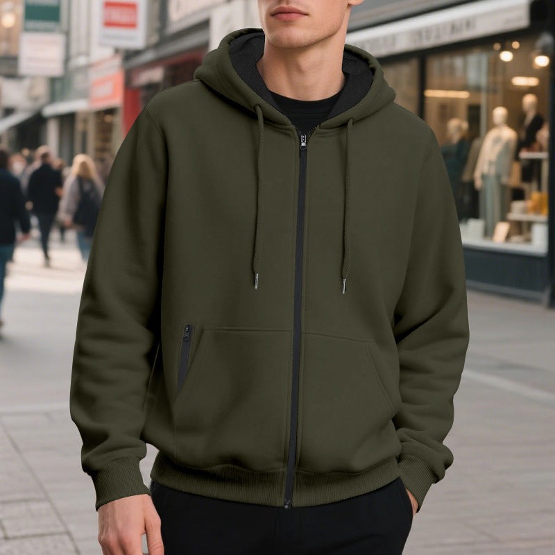 Men's oversized zip-up hoodie in olive green, worn, front view