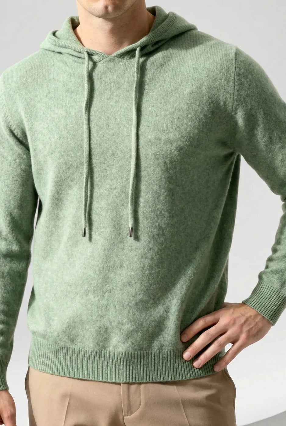 Men's fine-knit hooded jumper in sage green, worn, front view
