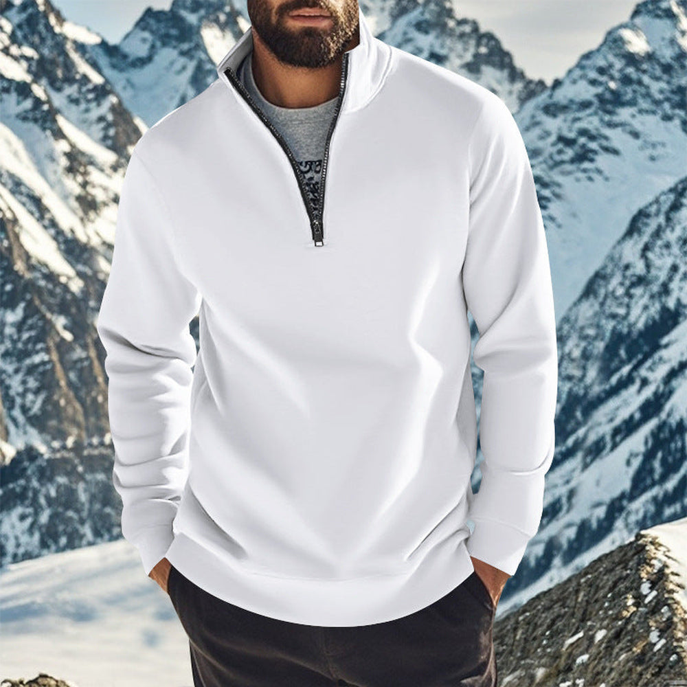 Man wearing a white quarter zip jumper over a grey T-shirt, hands in his pockets | Chaps London