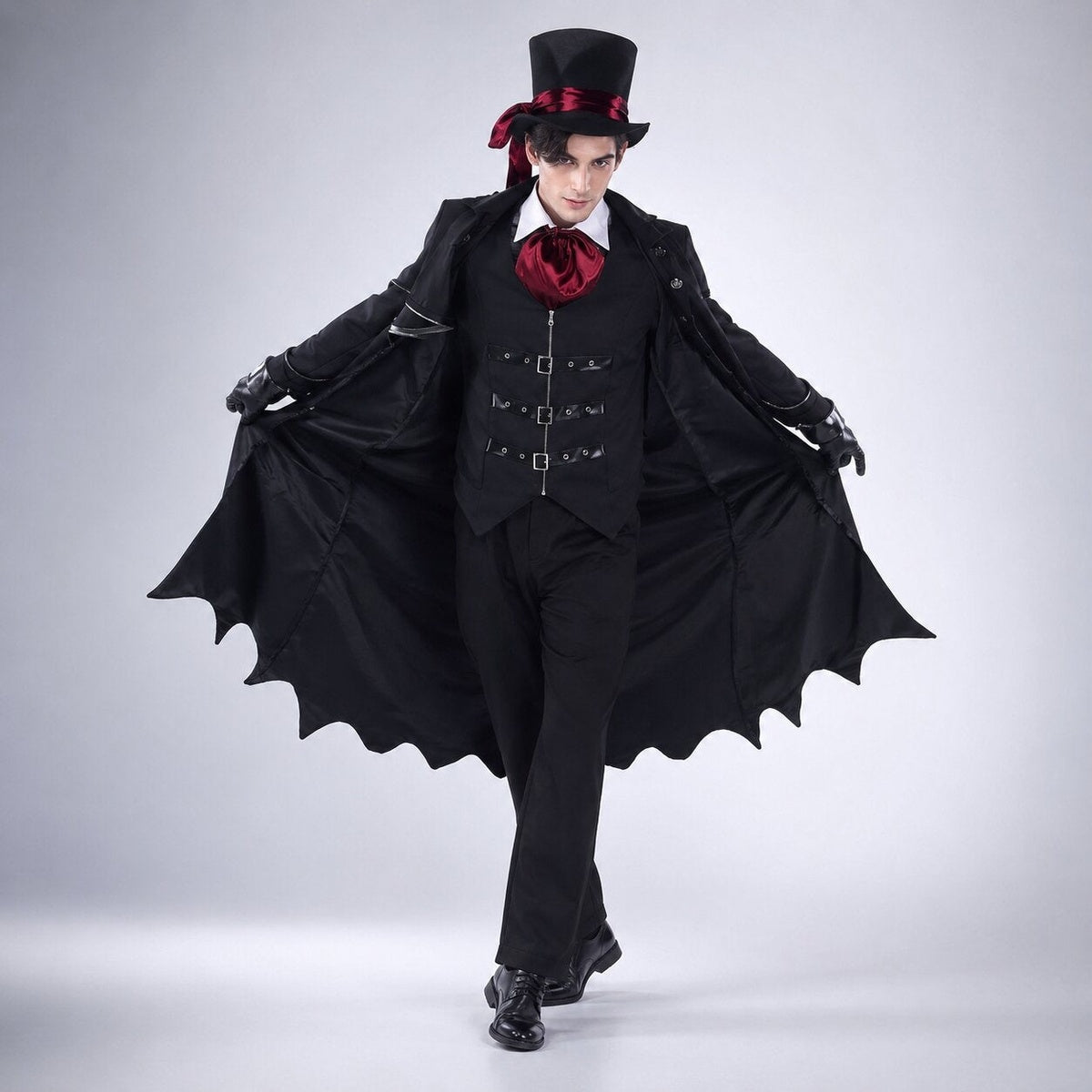 Man in the vampire costume opening the long bat-wing cape