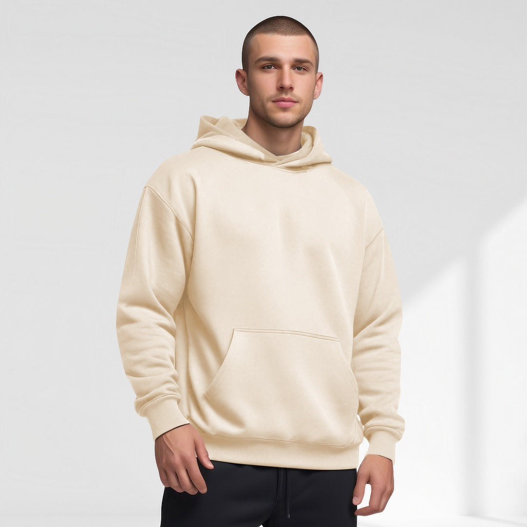 Men's oversized drop-shoulder hoodie in cream, worn, front view