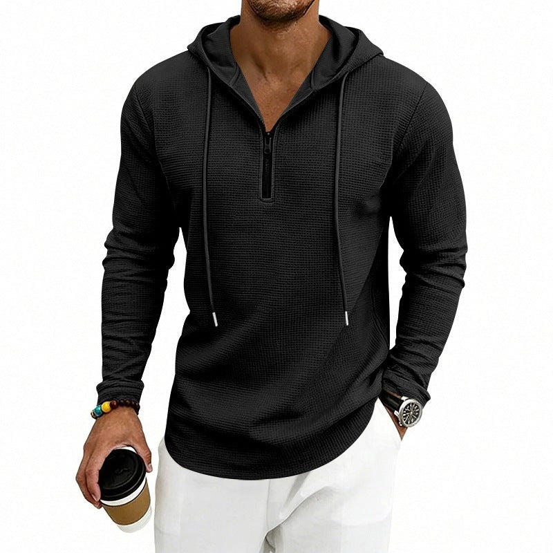 Men's textured quarter-zip hoodie in black, worn, front view