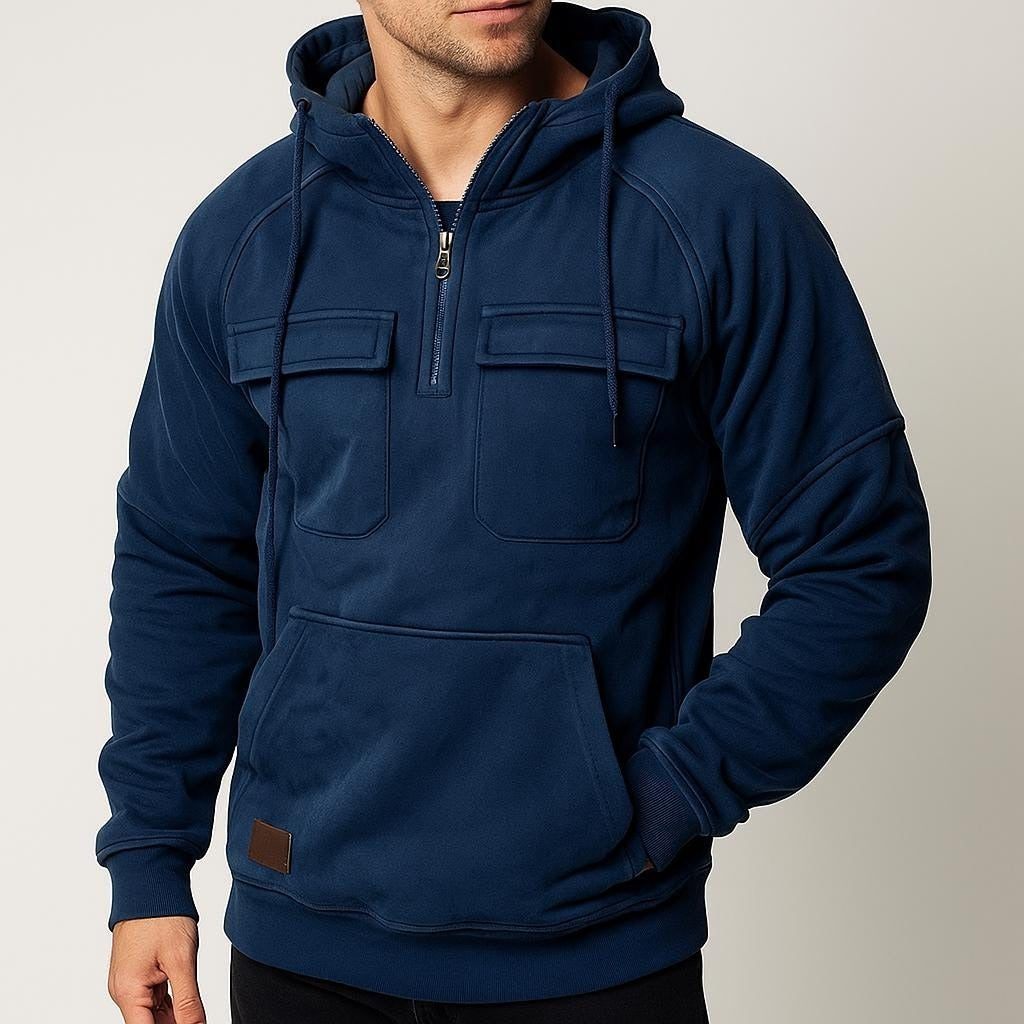 Men's half-zip utility hoodie with chest pockets in navy, worn, front view