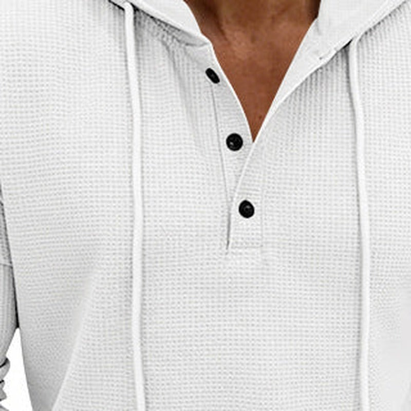 Men's waffle henley hoodie in white, close-up of the button placket, the drawstrings and the waffle texture