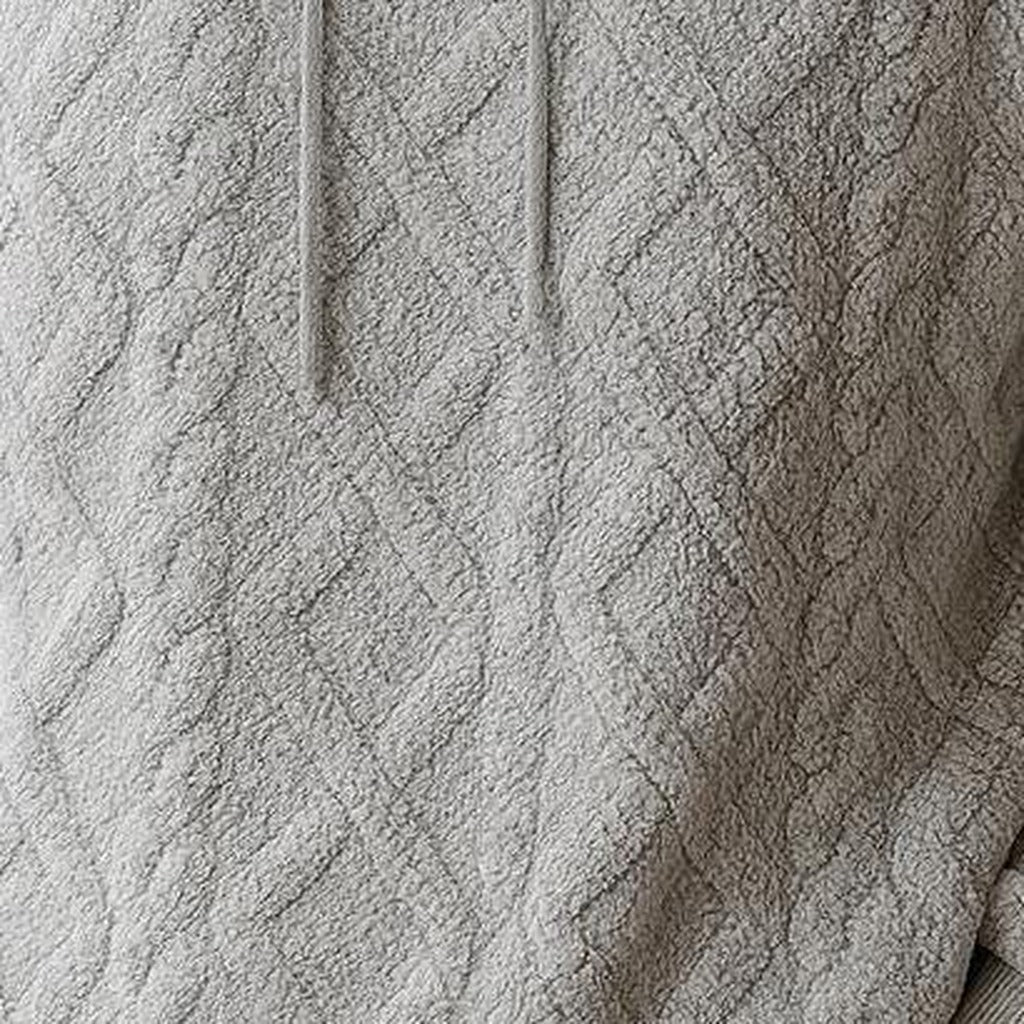 Men's quilted teddy fleece hoodie in grey, close-up of the fabric texture