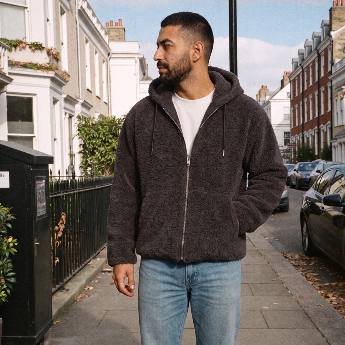 Men's hooded borg jacket in dark grey, worn by a model on a street