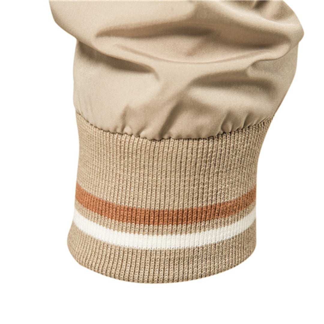 Beige jacket sleeve with knit cuff featuring brown and white stripes | Chaps London