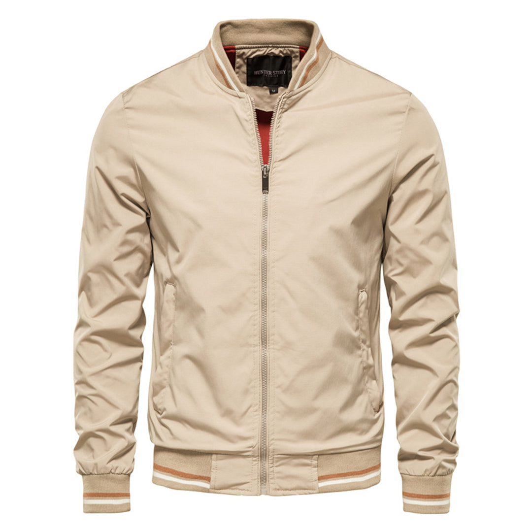 Beige bomber jacket with striped trim, worn by man, front view | Chaps London
