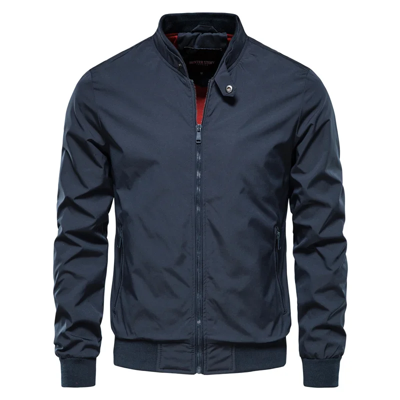 Navy blue zip-up bomber jacket with red trim, worn by man | Chaps London