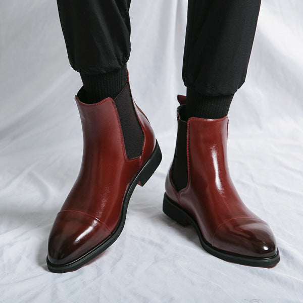 Burgundy faux leather Chelsea boots worn on feet, cap-toe design, glossy finish | Chaps London