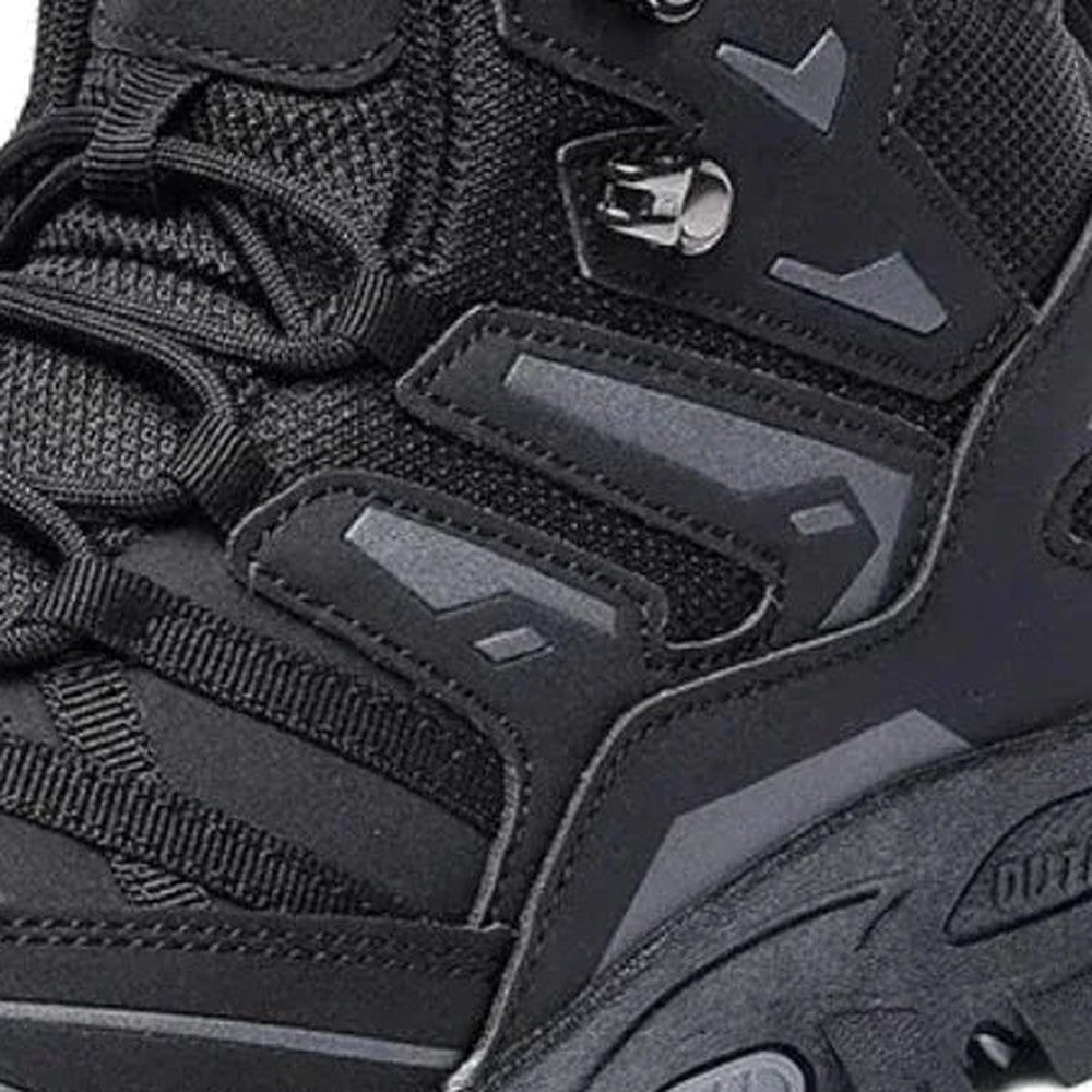 Black hiking boot close-up showing laces, mesh panels, and rugged textured sole | Chaps London