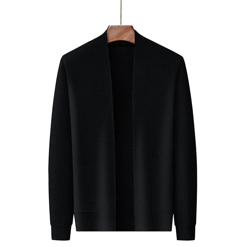 Black knitted open-front cardigan with textured pattern, displayed on hanger | Chaps London