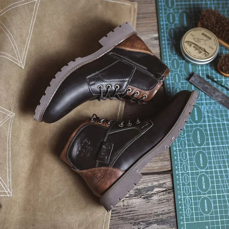 Black and brown lace-up ankle boots on green cutting mat, flat lay | Chaps London