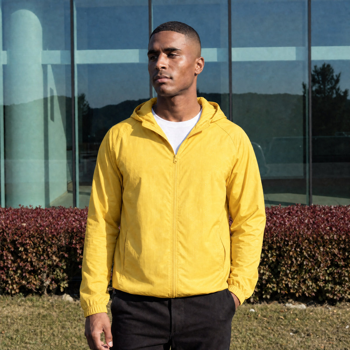 Men's lightweight hooded windbreaker jacket in yellow