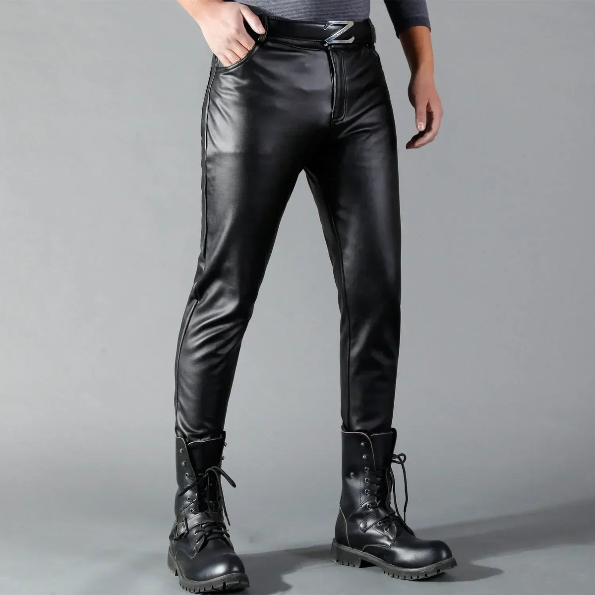Man wearing black faux leather slim fit pants with buckled belt | Chaps London