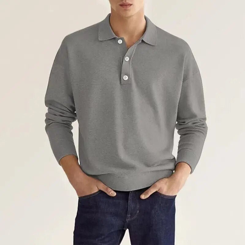 Man wearing gray long sleeve collared polo sweater with dark jeans | Chaps London