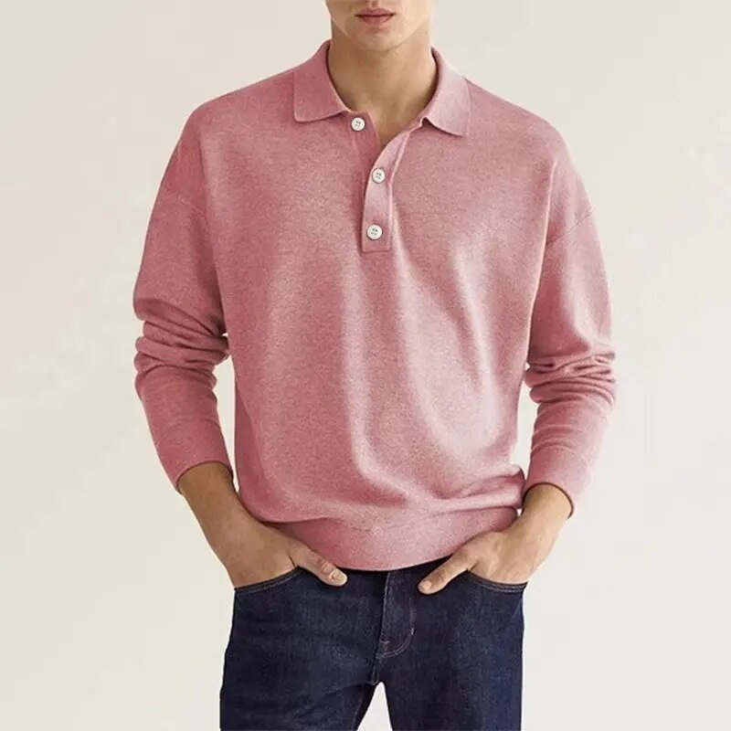 Man wearing pink knit polo sweater with buttoned collar and denim jeans | Chaps London