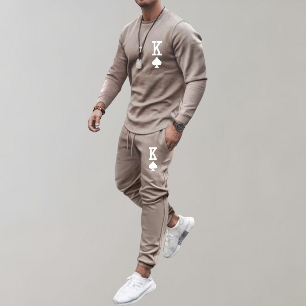 Man wearing beige tracksuit with jogger pants, worn in motion pose | Chaps London