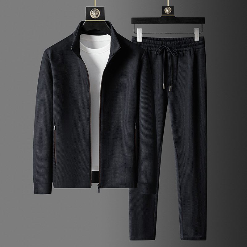 Black zip-up jacket and matching joggers displayed on hangers | Chaps London