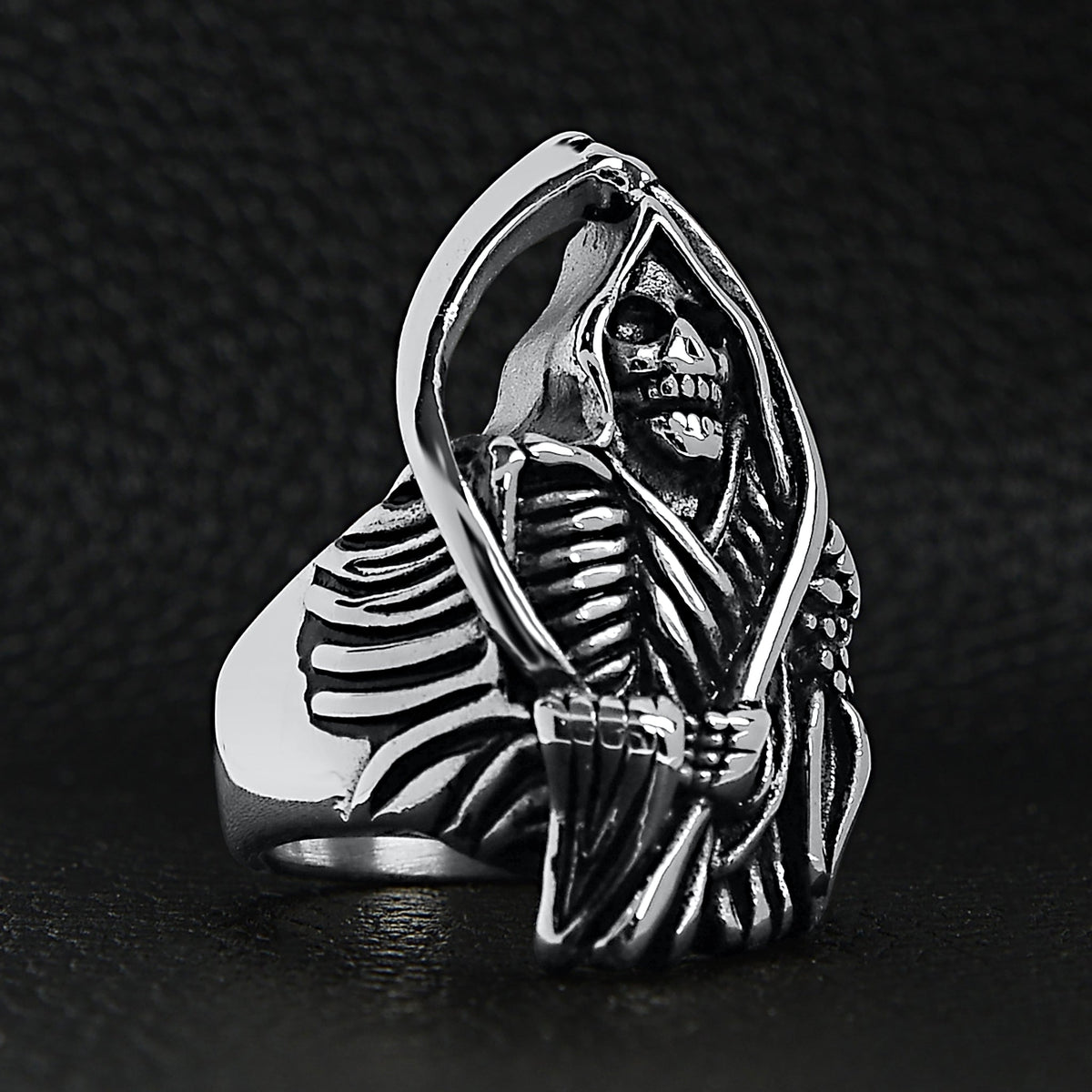 Silver ring featuring hooded grim reaper skeleton holding scythe, shown flat | Chaps London