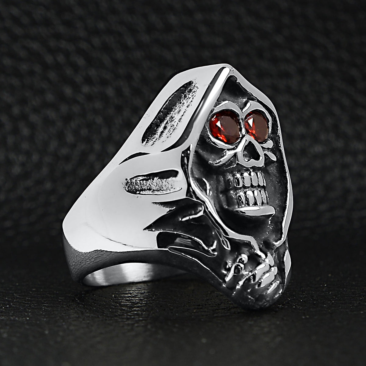 Silver hooded grim reaper skull ring with red gemstone eyes, displayed solo | Chaps London