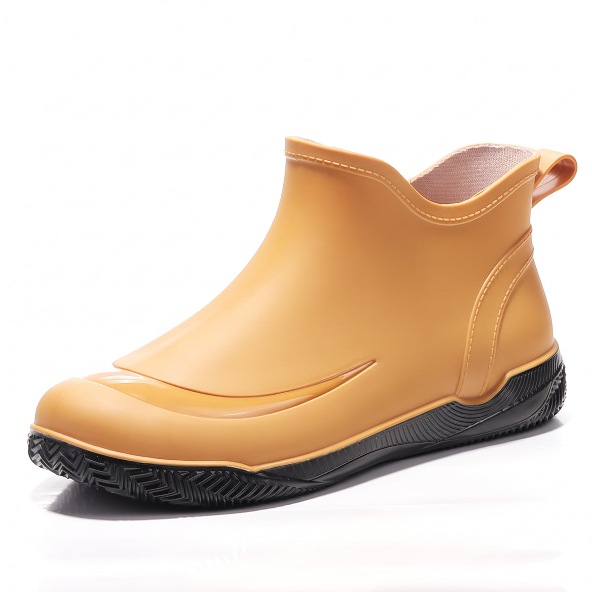 Yellow short welly with a black treaded sole, side view