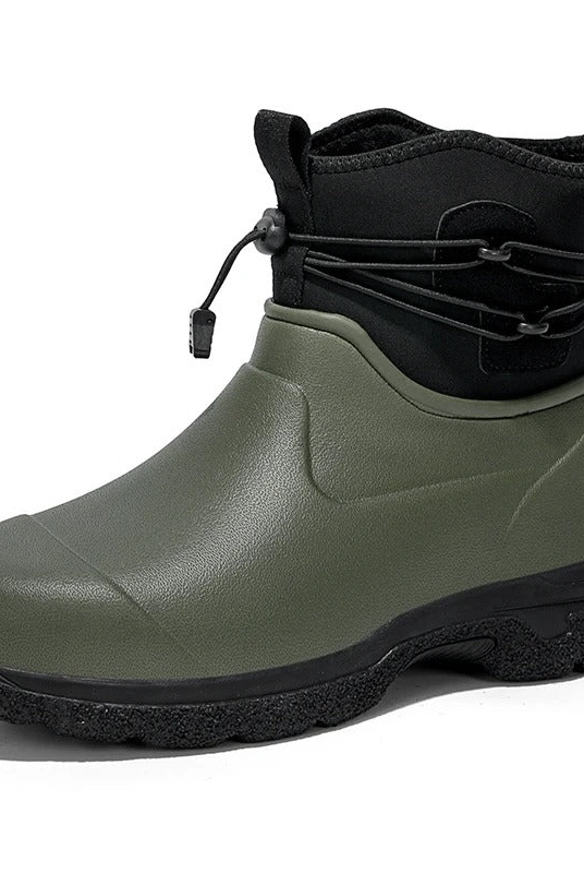 Olive green rubber ankle rain boot with a black neoprene collar, bungee drawstring lacing and a black lugged sole, shown in three quarter view on a white background.
