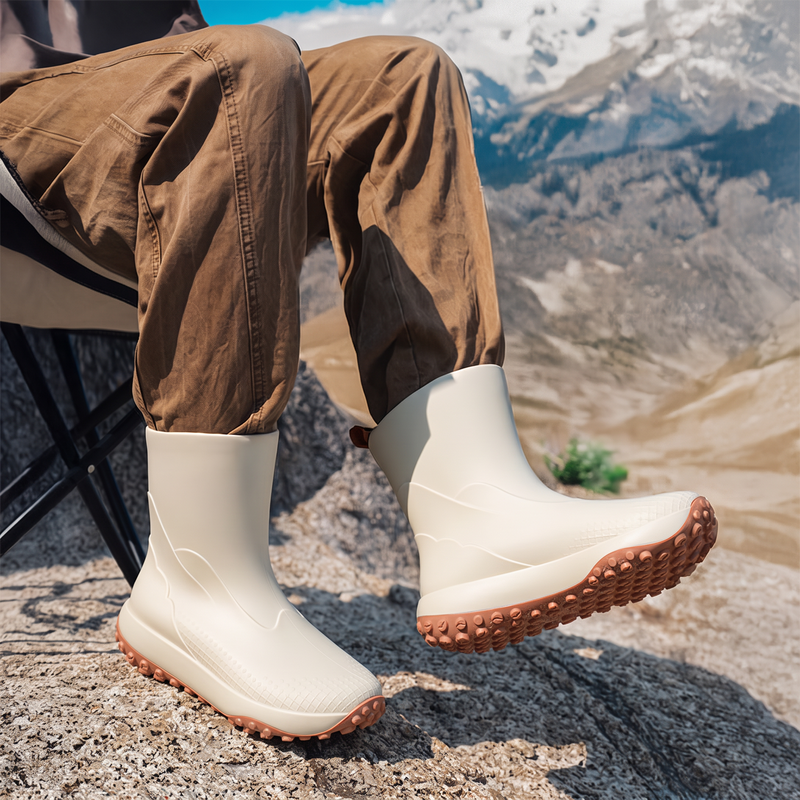 Beige men's wellies worn in the mountains