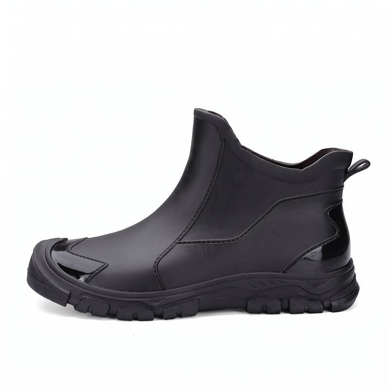 A black rubber ankle boot shown from the side against a white background.