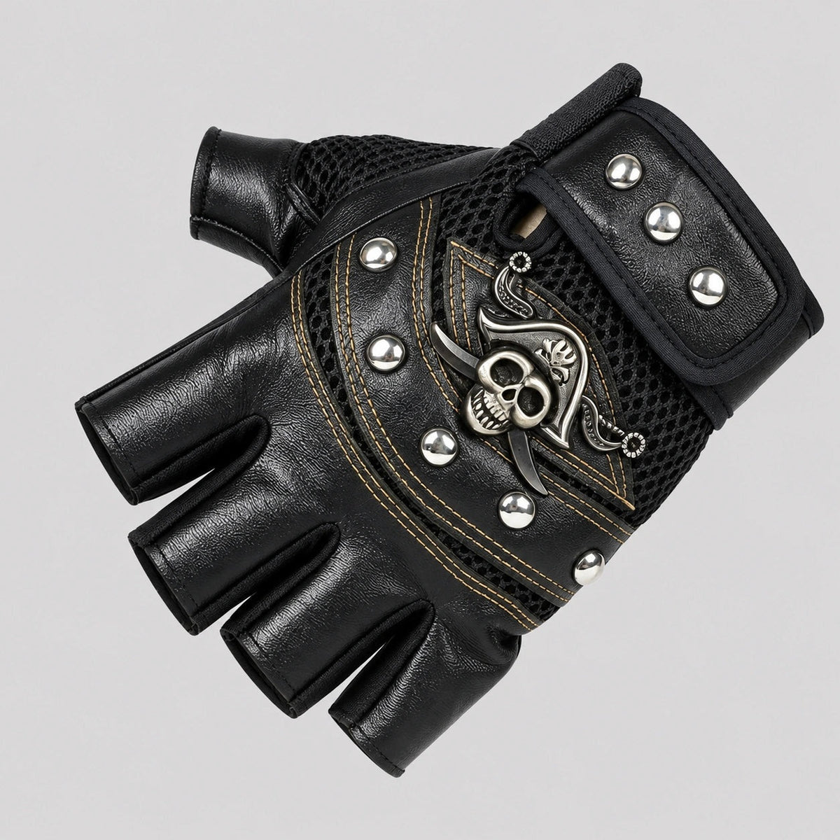 Black fingerless biker glove with skull emblem, rivets, and mesh detailing shown flat | Chaps London