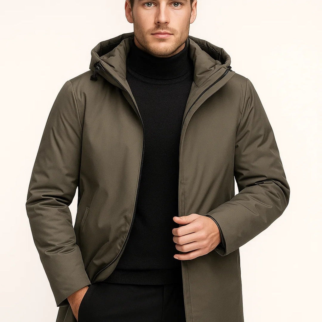 Man wearing olive green hooded parka with black turtleneck and trousers | Chaps London