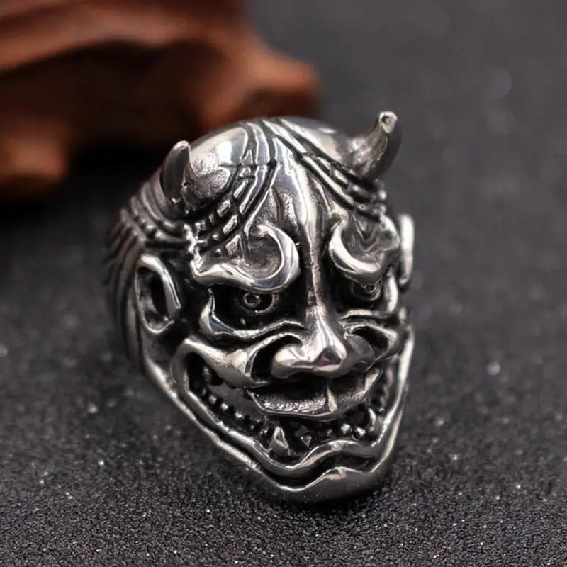 Silver Oni demon ring with horns, fanged grin, shown flat | Chaps London