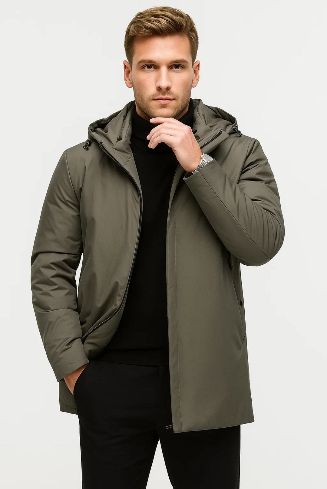 Man wearing olive green hooded parka jacket with black turtleneck and trousers | Chaps London