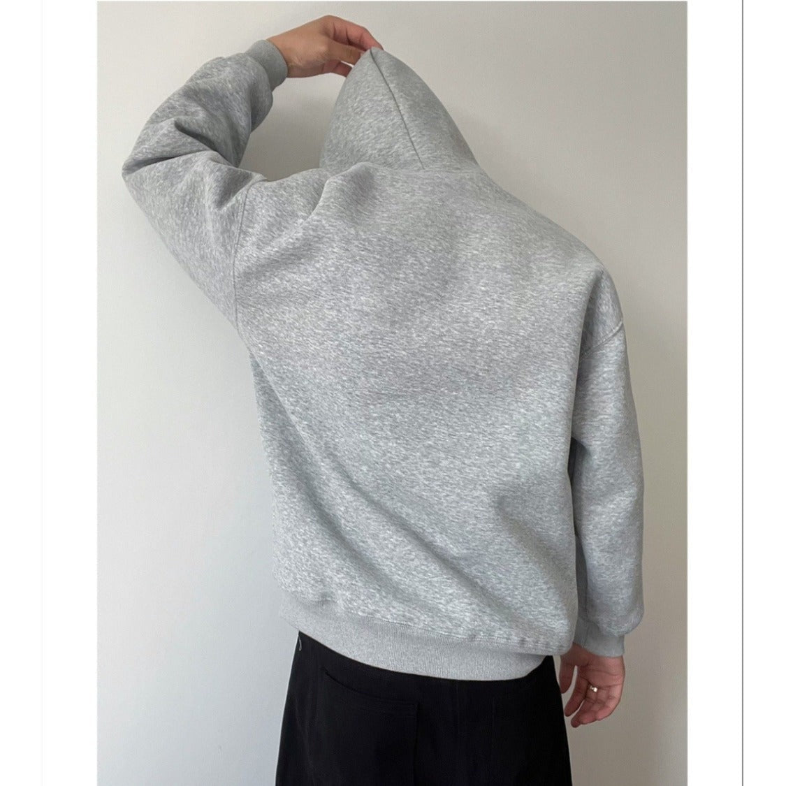 Gray oversized hoodie worn by person, back view, hood up | Chaps London