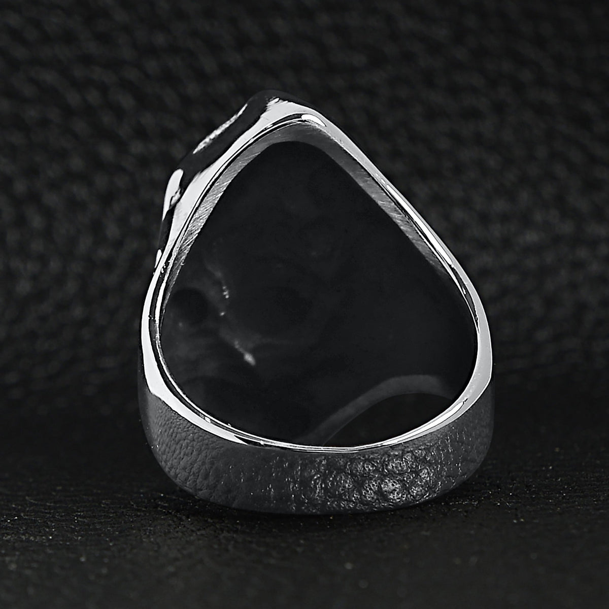 Silver ring back view showing hollow teardrop shape, shown flat on surface | Chaps London