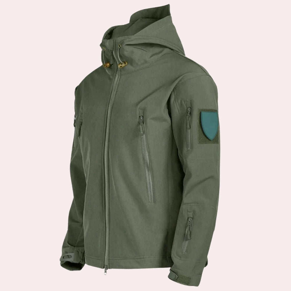 Olive green hooded softshell jacket with zip pockets, worn by person | Chaps London
