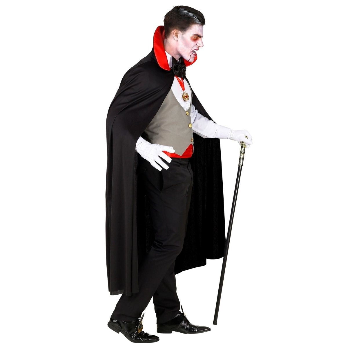 Man wearing black cape, grey waistcoat and red cummerbund, vampire costume | Chaps London