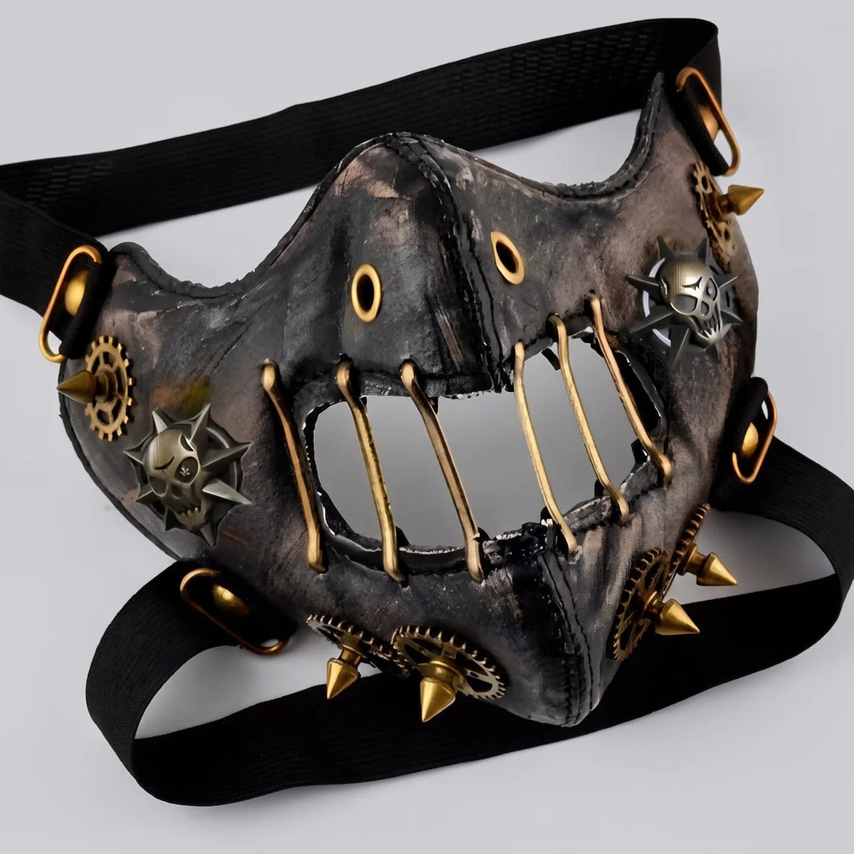 Black and gold steampunk half mask with spikes, gears, and rivets | Chaps London