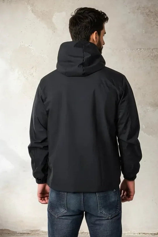 Man wearing black hooded rain jacket with jeans, viewed from behind | Chaps London
