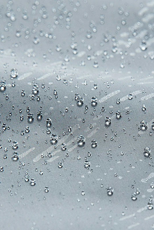 Water droplets beading on gray water-repellent fabric close-up | Chaps London