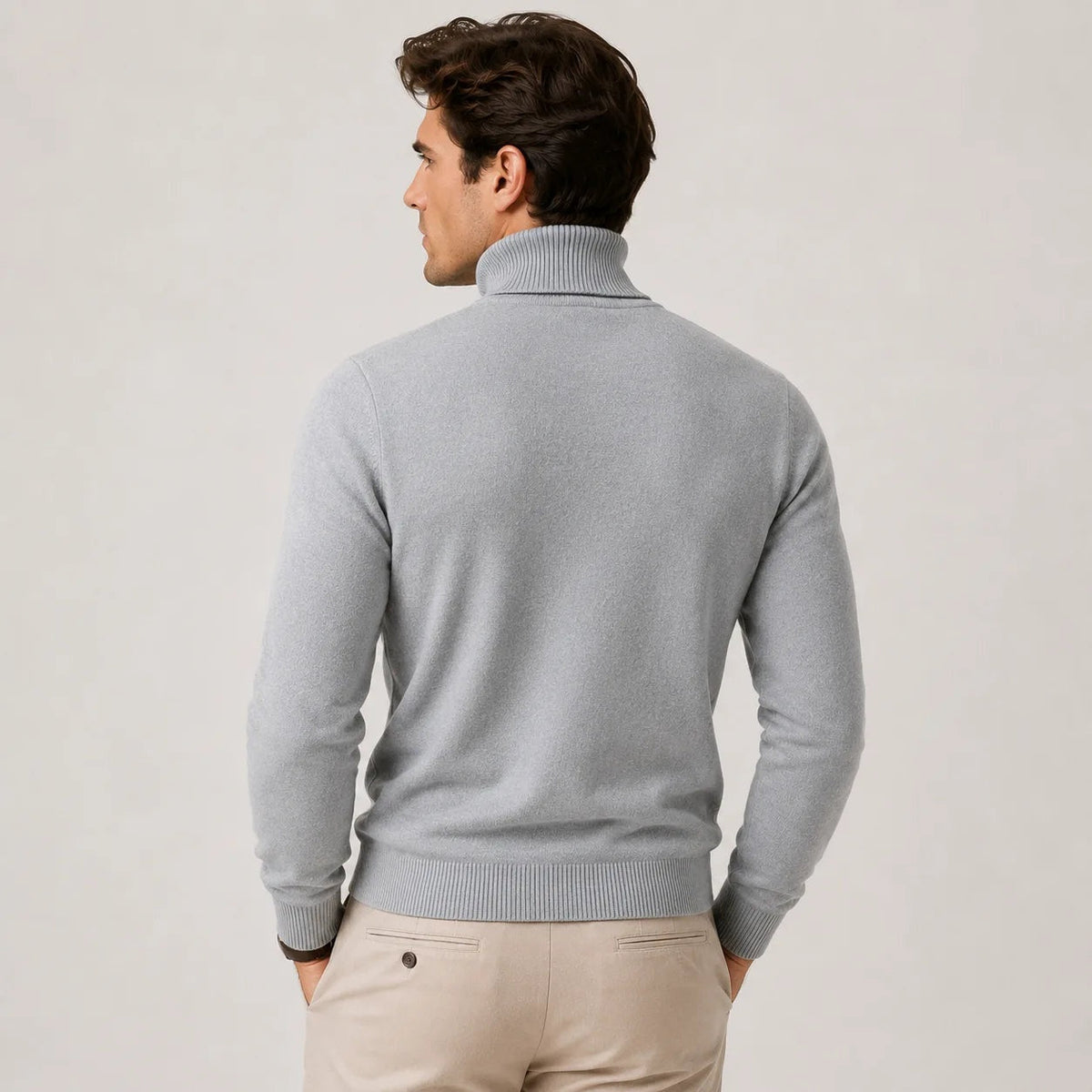 Man wearing grey ribbed turtleneck sweater, back view, with beige trousers | Chaps London