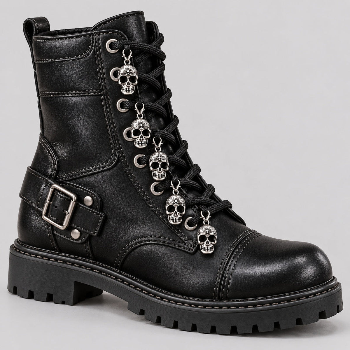 Black combat boot with silver skull charms on laces, side view | Chaps London