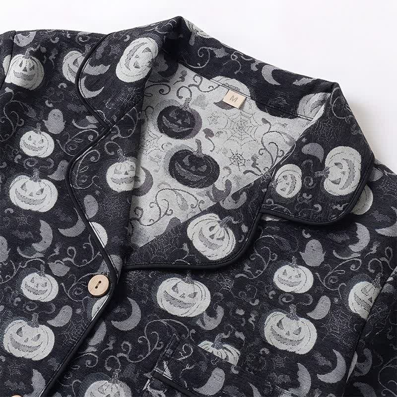 Black pyjama shirt collar close-up with pumpkin and ghost print pattern | Chaps London