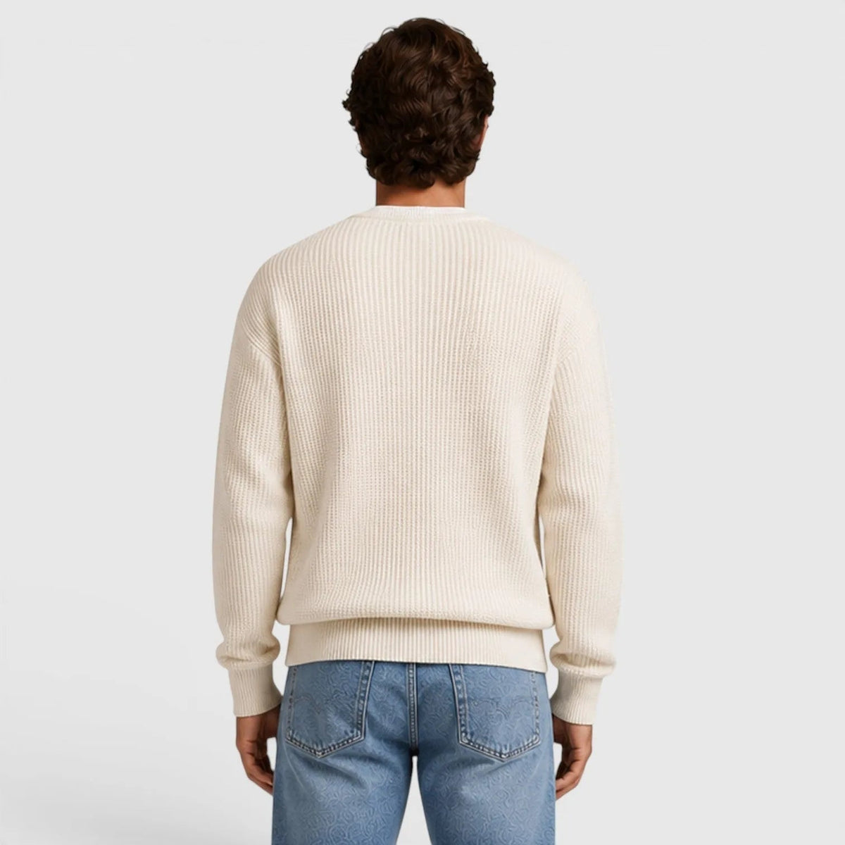 Man wearing cream ribbed knit crew neck sweater, back view, paired with jeans | Chaps London