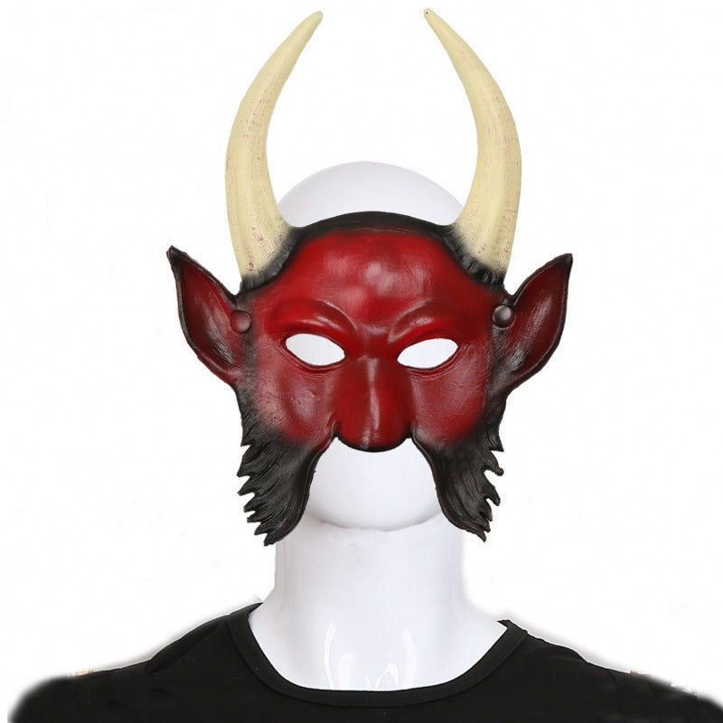 Red and black devil half mask with tan horns, worn by mannequin head | Chaps London